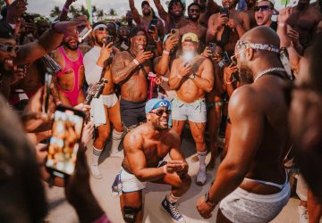 Vibrant crowd enjoying the Winter Party Festival in Miami Beach, celebrating electronic music and co.